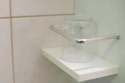 a glass jar sitting on a shelf in a bathroom at Apartment Ani in Bled