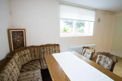 a dining room with a table and two chairs at Apartment Ani in Bled