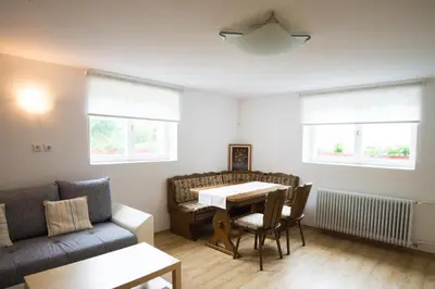 a living room with a table and a couch at Apartment Ani in Bled