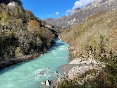 a river in the mountains with green water at Nadiza Hilltop Retreat in Breginj