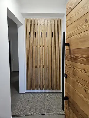 a wooden door in a room with a wall at Chalet Gozd Martuljek in Gozd Martuljek