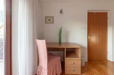 a table with a potted plant on top of it at Apt Regina with balcony and parking in Bled