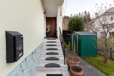 a row of stepping stones on the side of a house at Apt Regina with balcony and parking in Bled