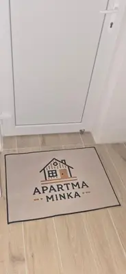 a rug on a floor in front of a door at Apartma Minka in Miklavž pri Ormožu