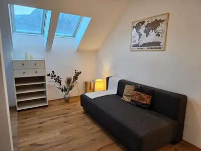 a living room with a couch and a dresser at Sunny AP22 in Bovec