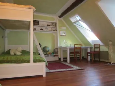 a bedroom with a bed with a dog laying on it at A precious apartment in Ljubljana in Ljubljana