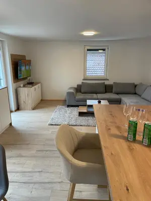a living room with a couch and a table at Ten villages in Žirovnica