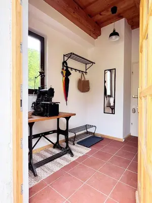 a room with a table and an umbrella on the wall at Holiday home in Semic - Kranjska (Krain) 51757 in Semič