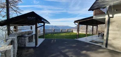 a picnic shelter with a view of the mountains at Vila Klif vacation home with sauna and terrace in Cerklje na Gorenjskem