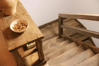 a wooden table with a bowl of nuts on it at Guesthouse Novak -Modern Barn Loft in Dvor