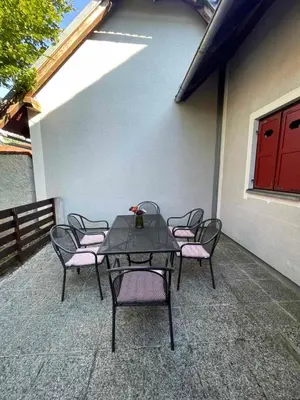 a table and chairs sitting on a patio at Terme Čatež apartma Maestro in Čatež ob Savi