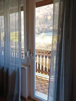 an open door with a view of a balcony at Apartma Vodrice in Slappe dʼIdria