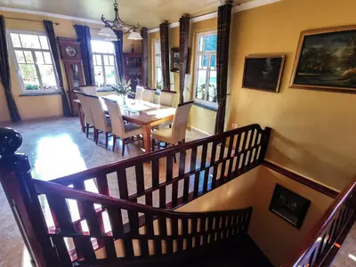 a dining room with a table and chairs at Geratičevo in Lovrenc na Pohorju