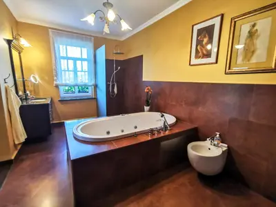 a large bathroom with a tub and a sink at Geratičevo in Lovrenc na Pohorju