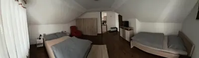 a room with two beds in a small room at Apartma Studio Bogi in Kranjska Gora