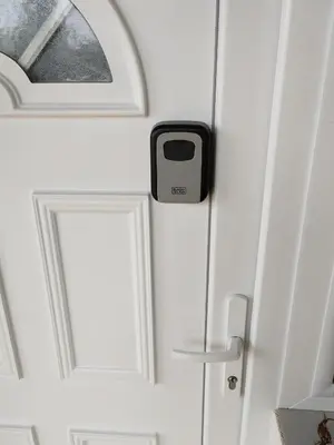 a door with a cell phone sticking out of it at apartma Pohorc - Praprot in Pohorje
