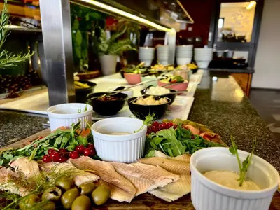 a buffet line with many different types of food at Hotel Natura in Zreče