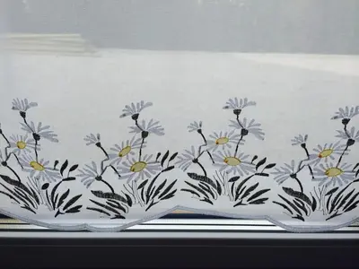 a plate with flowers painted on the side of it at Apartmaji Kranjska Gora in Kranjska Gora