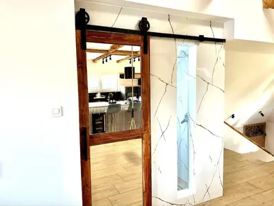an open door leading into a kitchen with a counter at City Central Loft with Parking in Maribor