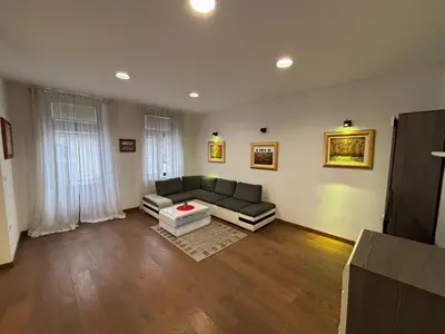 a living room with a couch and a table at Apartma Vila De Casa in Ribnica