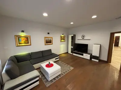 a living room with a couch and a tv at Apartma Vila De Casa in Ribnica