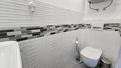 a bathroom with a toilet and a sink at Teeny tiny in Šentvid