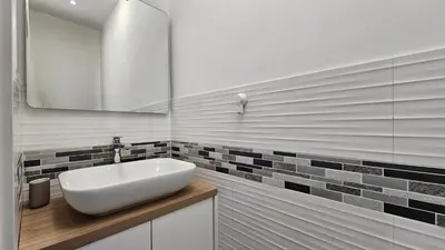 a bathroom with a white sink and a mirror at Teeny tiny in Šentvid