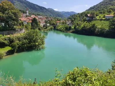 a view of a river with a town in the background at Avecchiasegheria in Most na Soči