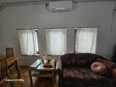 a living room with a couch and a table at Avecchiasegheria in Most na Soči
