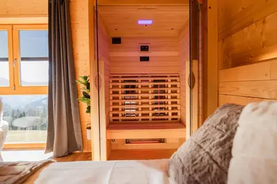 a bedroom with a built in wine cellar at Studio Wild Park Panorama with Hot tub and Sauna in Tolsti Vrh pri Ravnah naKoroškem