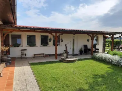 a patio with a pavilion and green grass at Apartments Isabella in Ptuj