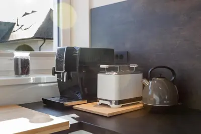 a coffee maker and a tea kettle on a counter at Hiša Urma in Celje