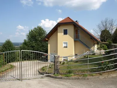 a gate in front of a house at Apartament VISOTA in Ptuj