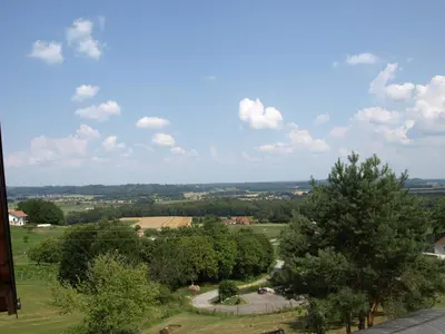 a view of a park with trees in a field at Apartament VISOTA in Ptuj