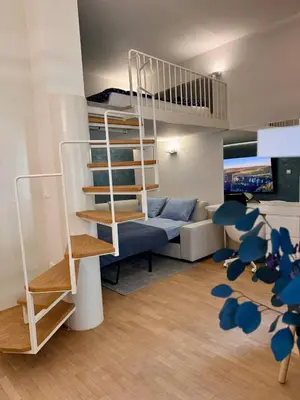 a living room with a bunk bed and a couch at Staro mesto & Dragon bridge in Ljubljana