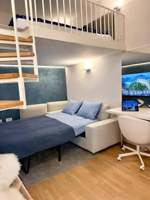 a bedroom with a bed and a loft bed at Staro mesto & Dragon bridge in Ljubljana