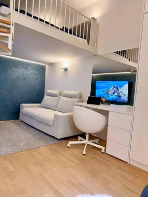 a living room with a couch and a loft bed at Staro mesto & Dragon bridge in Ljubljana