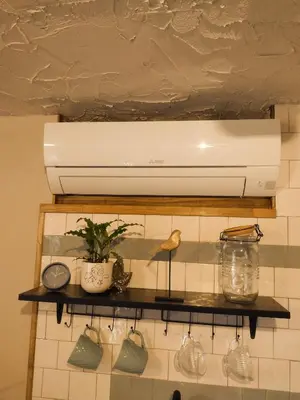 a white light above a shelf in a kitchen at Holidayapartement Sentjur 2 pers in Šentjur