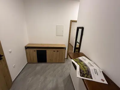 a room with a table and a bench in a room at Apartma EVA in Ormoz