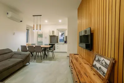 a living room with a couch and a table at Apartma EVA in Ormoz