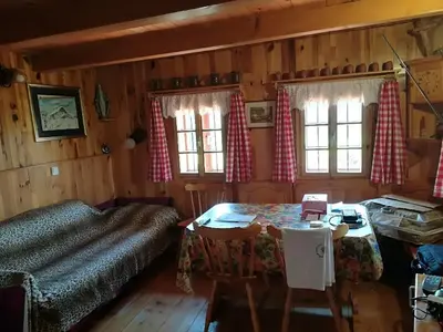 a bedroom with a bed and a table and chairs at Holiday Home Carovina in Paradiž