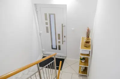 a room with a staircase with a door and a shelf at Apartment Mandi By DIMBIKES in Ajdovščina
