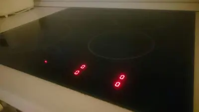 a clock with red lights on top of a stove at Colorful City Center Apartment - Parking Available in Ljubljana