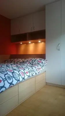 a bedroom with a bed in a room at Colorful City Center Apartment - Parking Available in Ljubljana