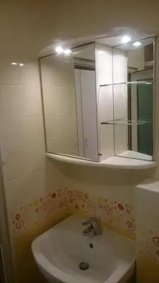 a bathroom with a sink and a mirror at Colorful City Center Apartment - Parking Available in Ljubljana