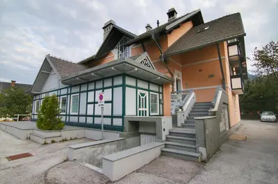 a house with a blue and white facade at GOLOB Apartment Kranjska Gora in Kranjska Gora