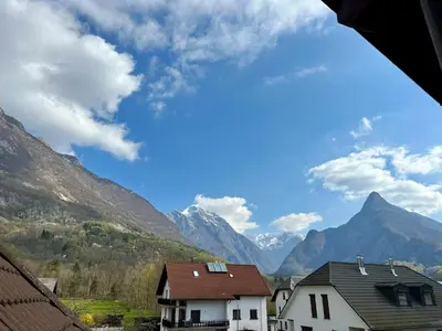a view of mountains and houses in a village at Relax Bovec in Bovec