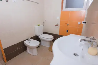 a bathroom with a toilet and a sink at Relax Bovec in Bovec