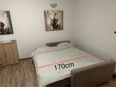 a bedroom with a bed with a marked room at Relax Bovec in Bovec
