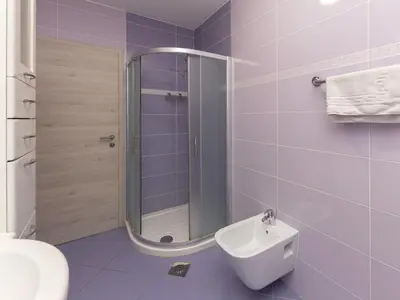a bathroom with a shower and a toilet and a sink at Apartment Pr' Kavač by Interhome in Rateče